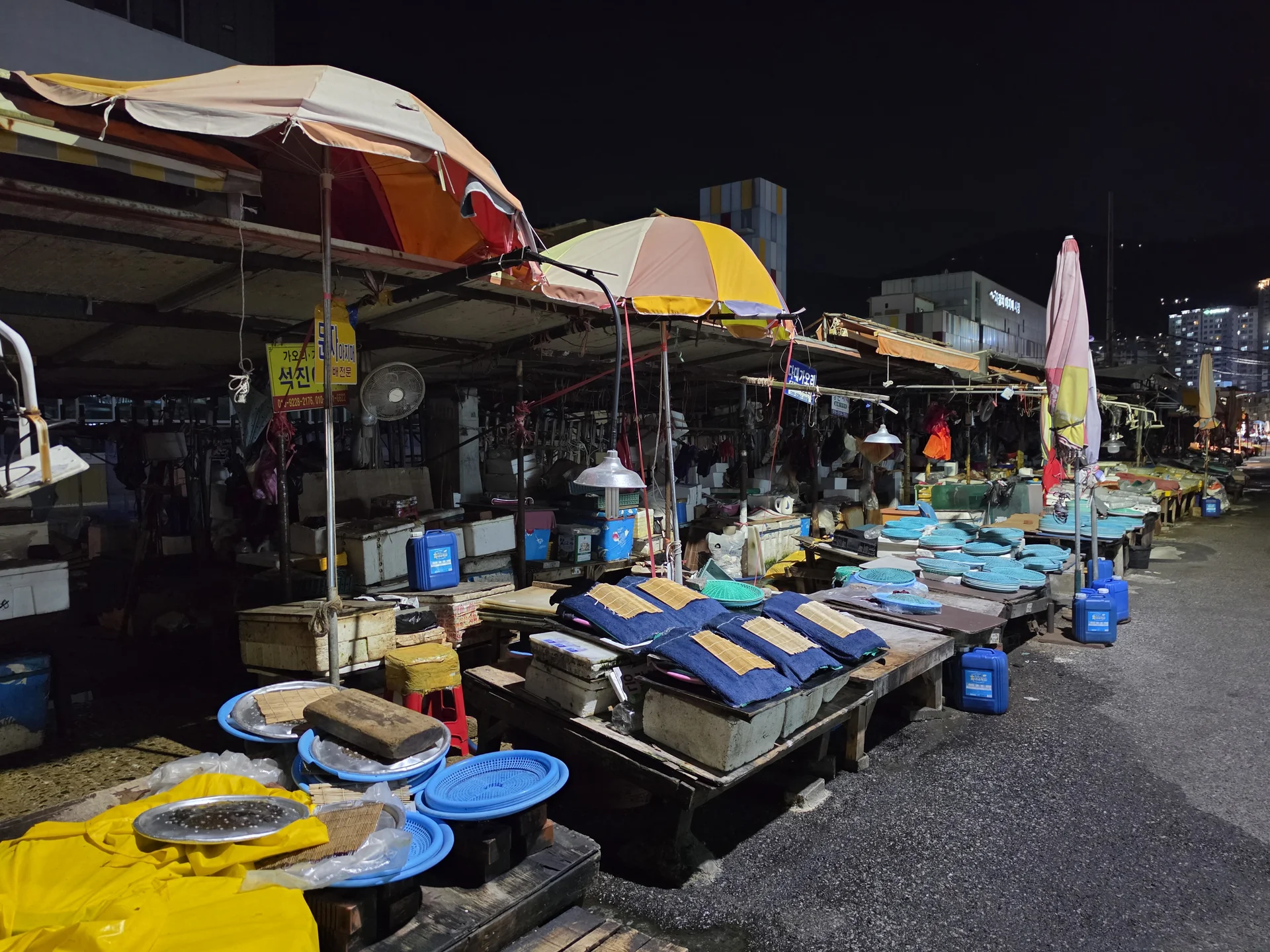 Covered market stalls at night in Jagalchi, Busan